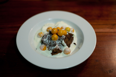 Flour-less chocolate cake with cream and cape gooseberries