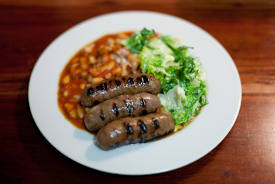 Sausages with homemade baked beans